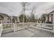 Spacious deck overlooking lush greenery, a grill, and stairs leading down to the yard at 7580 S Monaco Way, Centennial, CO 80112