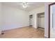 Bedroom with hardwood floors, ceiling fan, and walk-in closet at 7580 S Monaco Way, Centennial, CO 80112