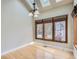 Dining area with skylights, large windows, and hardwood floors at 7580 S Monaco Way, Centennial, CO 80112
