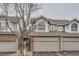 Beautiful exterior featuring a brick and siding facade, attached garage, and well-kept surroundings at 7580 S Monaco Way, Centennial, CO 80112