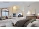 Bright main bedroom features vaulted ceilings, cozy fireplace, sitting area, and a dedicated office space at 7580 S Monaco Way, Centennial, CO 80112