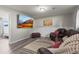 Relaxing basement living area with comfortable seating and mounted television at 13542 Achilles Dr, Lone Tree, CO 80124