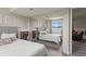 A spacious bedroom with mirrored closet doors is reflected in the image at 13542 Achilles Dr, Lone Tree, CO 80124