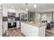 Updated kitchen boasts stainless appliances, modern cabinetry and a center island at 13542 Achilles Dr, Lone Tree, CO 80124
