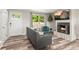 Bright living room featuring a cozy fireplace, comfortable seating, and stylish decor accents at 13542 Achilles Dr, Lone Tree, CO 80124