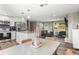 Open-concept kitchen and living room with dining area, great for entertaining at 13542 Achilles Dr, Lone Tree, CO 80124