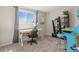Bright office space with modern desk, shelving, and a fun, colorful Simpsons accent piece at 13542 Achilles Dr, Lone Tree, CO 80124