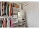 Walk-in closet featuring ample storage with shelving and clothing rods, and a full-length mirror at 13542 Achilles Dr, Lone Tree, CO 80124