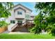 Two-story home with a large deck, stairs, and backyard lawn at 6534 S Union Way, Littleton, CO 80127