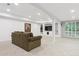 Spacious finished basement area featuring neutral carpet, recessed lighting and built-in shelving at 6534 S Union Way, Littleton, CO 80127