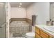 Bright bathroom featuring an oversized jacuzzi soaking tub, tile surround, and wooden cabinets at 6534 S Union Way, Littleton, CO 80127