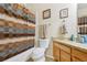 Charming bathroom featuring a shower/tub combo with a stylish curtain and a granite-topped vanity at 6534 S Union Way, Littleton, CO 80127