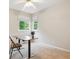 Bright bedroom with neutral walls, carpet flooring and a large window overlooking the green space at 6534 S Union Way, Littleton, CO 80127
