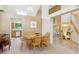 Cozy dining room with a wooden table set, open to the kitchen and living areas at 6534 S Union Way, Littleton, CO 80127