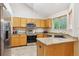 Modern kitchen with granite countertops, stainless steel appliances, and ample cabinet space at 6534 S Union Way, Littleton, CO 80127