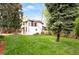 Beautiful exterior with lush lawn and mature trees at 2715 W 37Th Ave, Denver, CO 80211