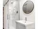 Modern bathroom featuring a tiled shower, sleek vanity and contemporary fixtures at 2715 W 37Th Ave, Denver, CO 80211
