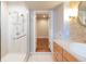 Modern bathroom with a sleek shower, custom cabinets, granite countertops, and a stylish vessel sink at 2715 W 37Th Ave, Denver, CO 80211