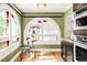 Charming breakfast nook features arched windows, hardwood floors, and modern appliances at 2715 W 37Th Ave, Denver, CO 80211