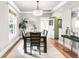 Elegant dining room with a large table and chairs, bright lighting, and modern decor at 2715 W 37Th Ave, Denver, CO 80211