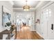 Bright foyer with hardwood floors, a stylish light fixture, and decorative columns at 2715 W 37Th Ave, Denver, CO 80211