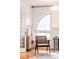 Stylish chair is complemented with hardwood floors, modern fireplace and natural light at 2715 W 37Th Ave, Denver, CO 80211