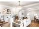 Bright and airy living room with hardwood floors, comfortable seating, and a charming archway at 2715 W 37Th Ave, Denver, CO 80211