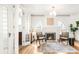 Cozy living room features a fireplace, hardwood floors, and natural light from arched windows at 2715 W 37Th Ave, Denver, CO 80211