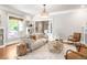 Cozy living room featuring hardwood floors, neutral decor, and ample natural light at 2715 W 37Th Ave, Denver, CO 80211