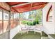 Cozy sunroom with wicker chairs, artificial grass, and a view of the backyard at 2715 W 37Th Ave, Denver, CO 80211