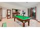 Finished basement featuring a kitchenette, exercise equipment, and pool table for entertainment at 458 Adams St, Denver, CO 80206
