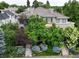 Stunning two-story home featuring lush landscaping, dual staircases, and a serene balcony at 458 Adams St, Denver, CO 80206