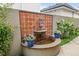 Outdoor stone fountain with custom tilework and surrounding foliage adding a serene accent to the yard at 458 Adams St, Denver, CO 80206