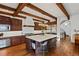 Spacious kitchen with an island, stainless steel appliances, and custom wood cabinetry at 458 Adams St, Denver, CO 80206