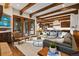 Spacious open-plan living area with hardwood floors, exposed beams, and seamless flow to the gourmet kitchen at 458 Adams St, Denver, CO 80206