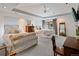Serene main bedroom with a ceiling fan, sitting area, and an ensuite bathroom at 458 Adams St, Denver, CO 80206