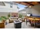 Charming outdoor patio with a built-in grill, comfortable seating, and a decorative water feature for relaxation at 458 Adams St, Denver, CO 80206