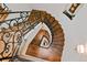 Unique spiral staircase featuring wood steps, iron railings, and modern lighting at 458 Adams St, Denver, CO 80206