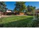 Landscaped backyard with a wooden fence at 8015 W Calhoun Pl, Littleton, CO 80123