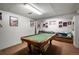 Finished basement with a pool table and sitting area at 8015 W Calhoun Pl, Littleton, CO 80123