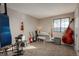 Music room with instruments and keyboard at 8015 W Calhoun Pl, Littleton, CO 80123