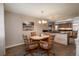 Dining area with kitchen passthrough and view to kitchen at 8015 W Calhoun Pl, Littleton, CO 80123