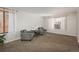 Living room with two armchairs and large window at 8015 W Calhoun Pl, Littleton, CO 80123