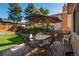 Deck with patio table and umbrella at 8015 W Calhoun Pl, Littleton, CO 80123