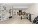 Finished basement featuring exercise equipment, a bar, and built-in shelving at 175 Harrison St, Denver, CO 80206