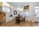 Bright dining area with wood floors, white walls, shuttered windows, and stylish decor at 175 Harrison St, Denver, CO 80206