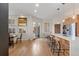 An open floorplan with a modern kitchen features an eat-in island and stainless appliances at 175 Harrison St, Denver, CO 80206