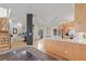 Modern kitchen with a large island, bar seating, wood cabinets, and stainless appliances at 175 Harrison St, Denver, CO 80206