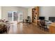 Bright office space featuring a desk, shelving, and French doors leading to a balcony at 175 Harrison St, Denver, CO 80206