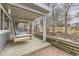 A covered patio with string lights and a swing provide backyard seating at 13883 E Radcliff Pl, Aurora, CO 80015